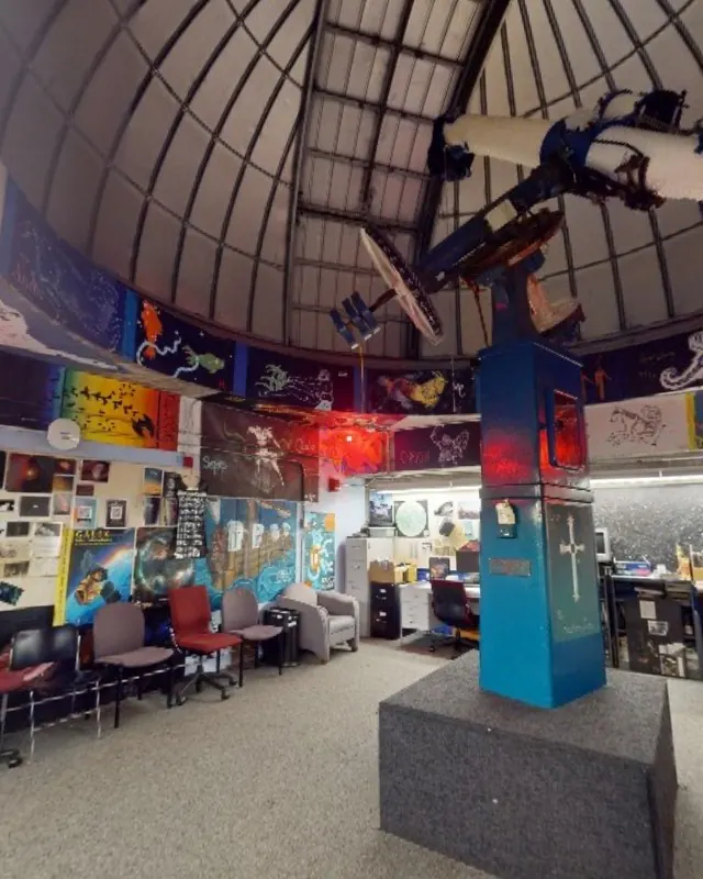 A refracting telescope under the observatory dome